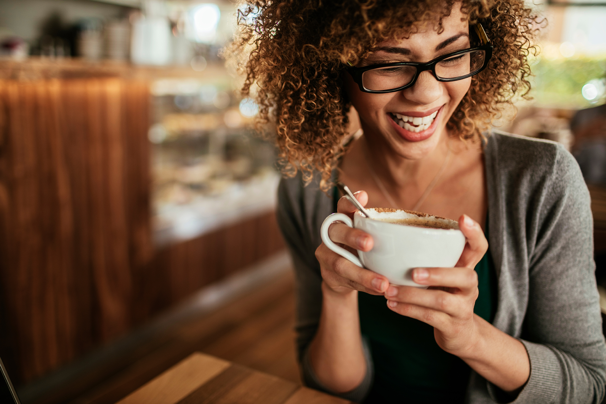 Woman Smiling with Coffee